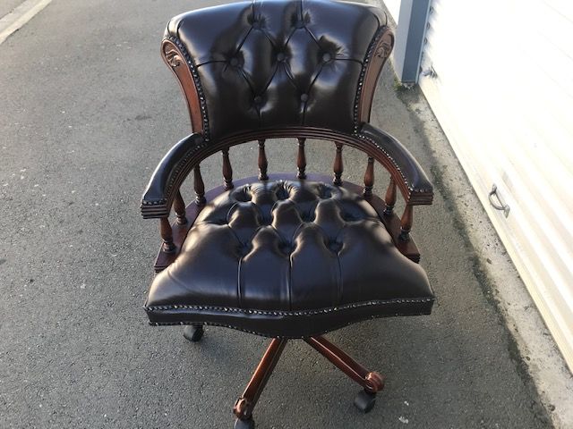 Captains chair in brown top grain leather and pecan antique finish to match the Presidents desk, hand made